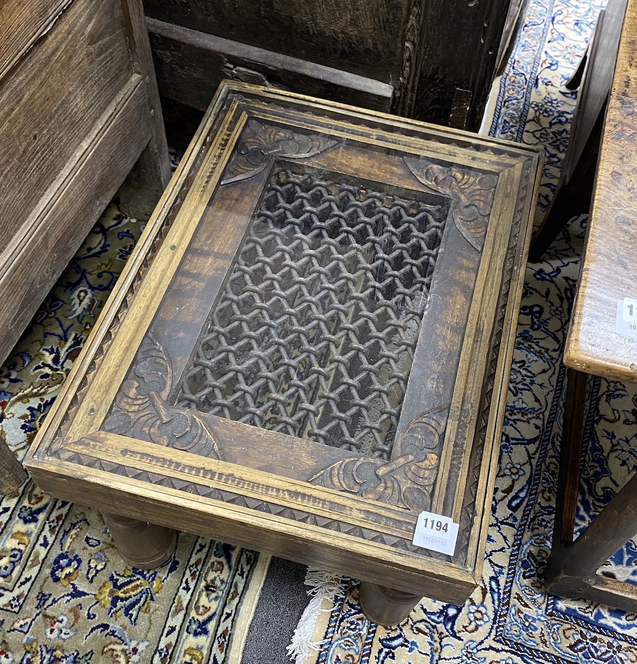 An Indian hardwood glass topped occasional table, width 60cm, depth 45cm, height 38cm